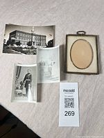 Lot overview: brass frame and three photographs