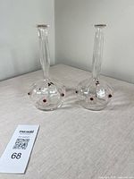 Full view of both decanters showing shape, cut facets, and red prunts