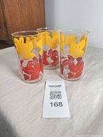 Three maple leaf motif glass tumblers front view