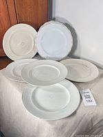 Front view of all plates showing two styles and overall wear