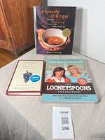 All three books arranged on table showing covers