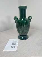 Full front view of green glazed Beauceware urn vase with handles