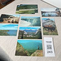 Fronts of all nine postcards laid out