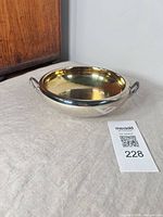 Top view of silver-plate bowl with gold interior and two handles