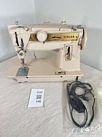 Front view of Singer 411G with power cord bag