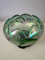 Overall view of iridescent green mist rose bowl showing ruffled edge and floral painting