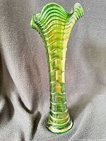 Front view of helios green ripple carnival glass vase showing color, shape and overall condition