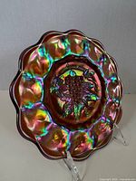 Front view of Imperial Heavy Grape carnival glass plate