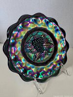 Front view showing iridescent grape motif and scalloped rim