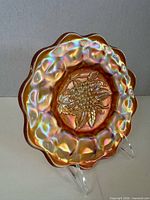 Front view showing marigold iridescence and grape motif