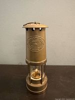 Full view of brass miner's lantern front