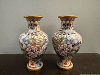 Front view of both matching floral porcelain vases