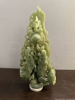 Front view of green stone Chinese dragon carving