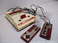 Console top view with controllers and cables