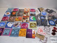 Overview of sealed string sets, loose singles and accessories