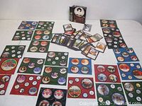 Overview of Pearl Edition box, loose L5R cards and multiple Diskwars sheets