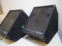 Pair of Yorkville YS-115 speakers angled as floor monitors