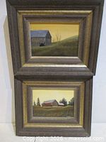 Both framed paintings stacked to show matching frames and size