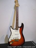 Front view of sunburst Fender Stratocaster guitar