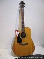 Full front view of Fender DG-10CELH-NAT guitar showing natural finish and left-hand cutaway body