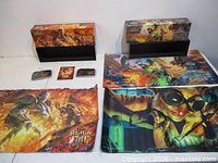 Group shot showing both display boxes, three playmats and two small card inserts