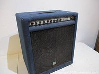 Front angled view of Yorkville Bass Master 100 amplifier showing grille, control panel and handle