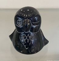 Front view of black soapstone owl figurine