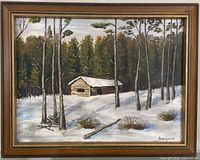 Full view of framed oil painting showing cabin in snowy forest
