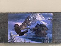 Front view of wood plaque showing the eagle landscape print