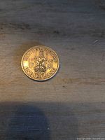 Reverse of 1948 one shilling coin showing crown and date