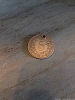 Obverse of 1951 5 Deutsche Mark coin showing denomination, date, inscriptions, drilled hole