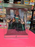 Front view of boxed 2004 Holiday Barbie in emerald green dress