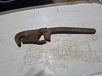 Full view of rusted adjustable pipe wrench