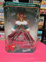 Front view of boxed 1995 Happy Holidays Barbie showing doll and gown