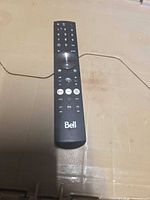 Full view of Bell remote front showing buttons and logo