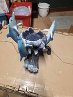 Full view of dolphin resin candle holder front