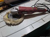 Full view of Chicago Electric polisher with wool bonnet attached