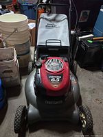 Full view of Craftsman mower showing deck, engine, handle and bag