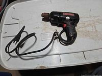 Full view of Craftsman corded drill with power cord and plug visible