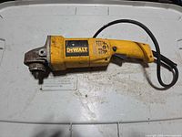 Left side view of DeWALT DW821 grinder showing overall condition and cord