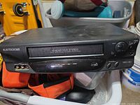 Front view showing Electrohome branding, 4-head Hi-Fi Stereo label, front RCA inputs, controls