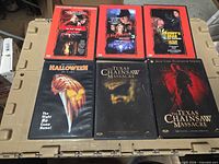 Six DVD cases laid out showing cover art for all titles