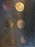 Six Italian 100 Lire coins obverse and reverse views