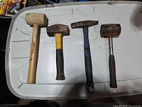 All four striking tools laid out side by side