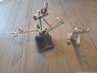 Both helping hand soldering tools side by side