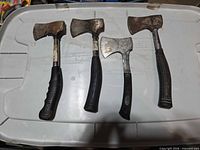 Four hatchets laid out showing entire forms