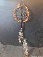 Full view of dreamcatcher showing hoop, web, feathers