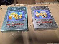 Front view of both DVD box sets closed