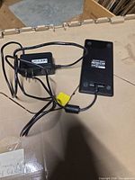 Charging pad and AC adapter laid out showing full lot