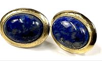 Front view showing blue stones in gold-plated bezels